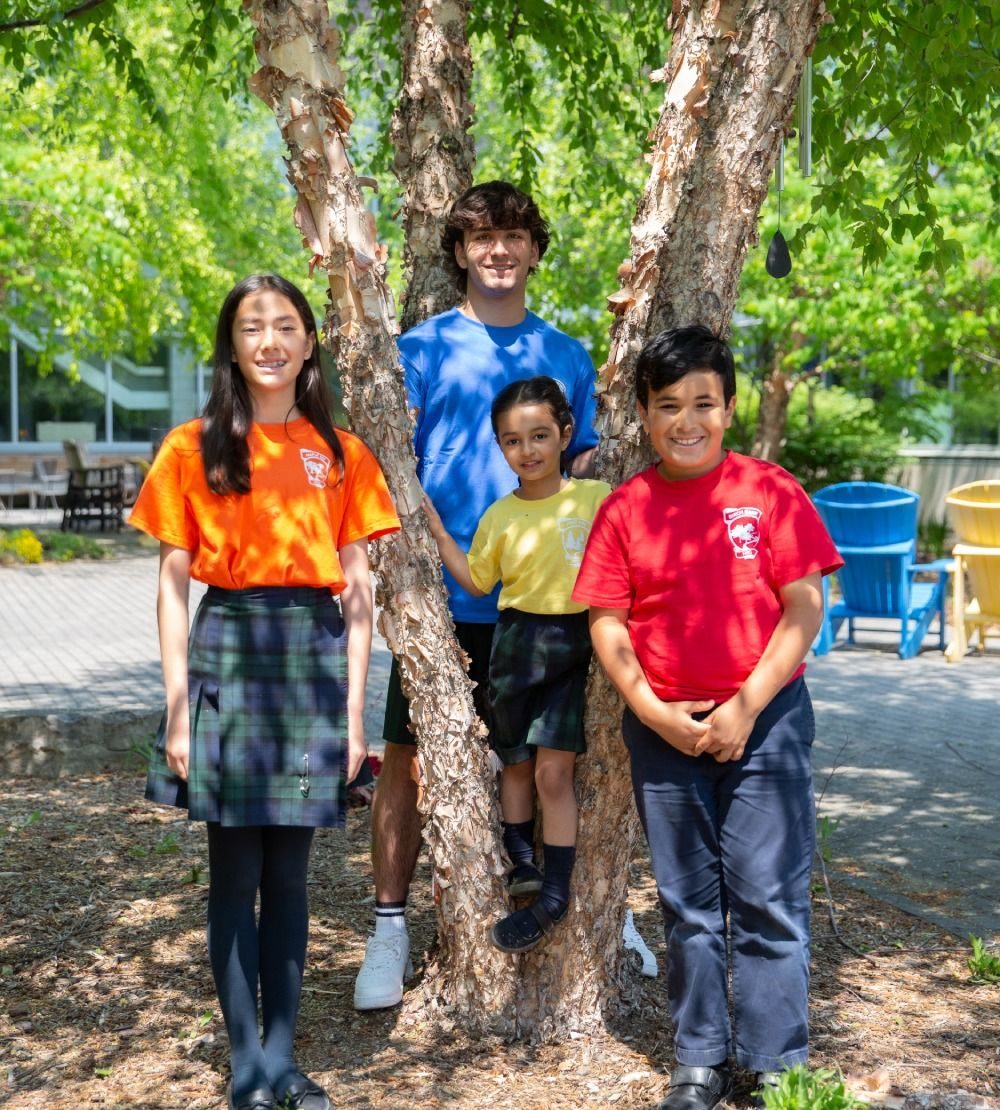 students standing by tree