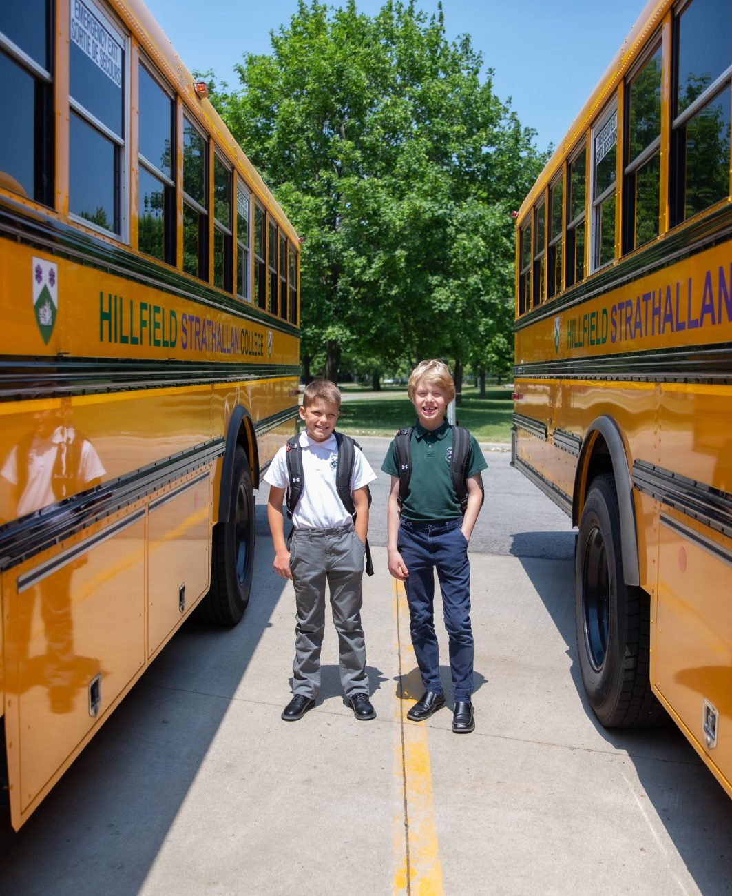 Students stand by the bus