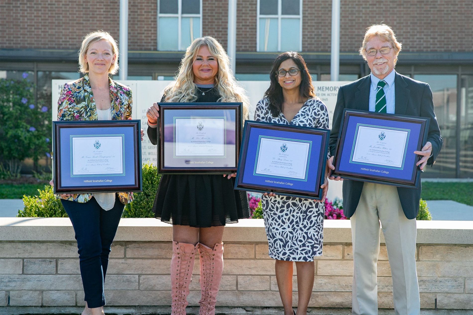 alumni holding awards