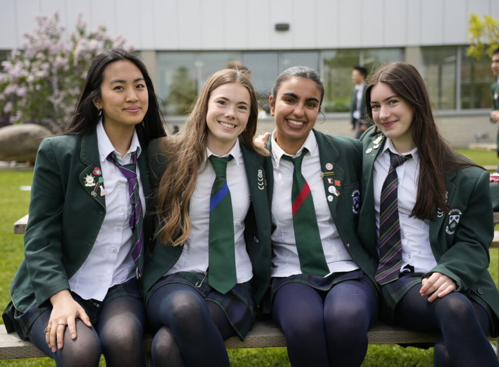 girls sitting together outside