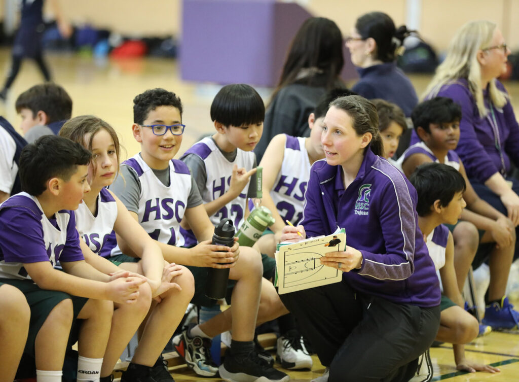 sports coach speaking with players