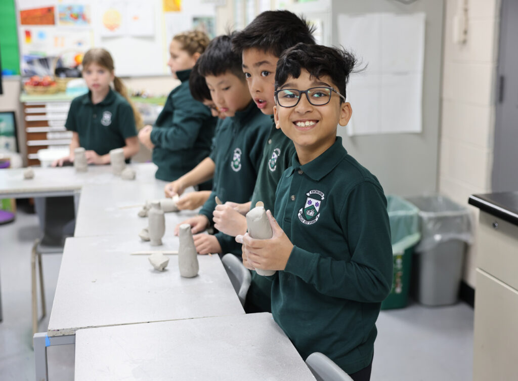 students clay sculpting